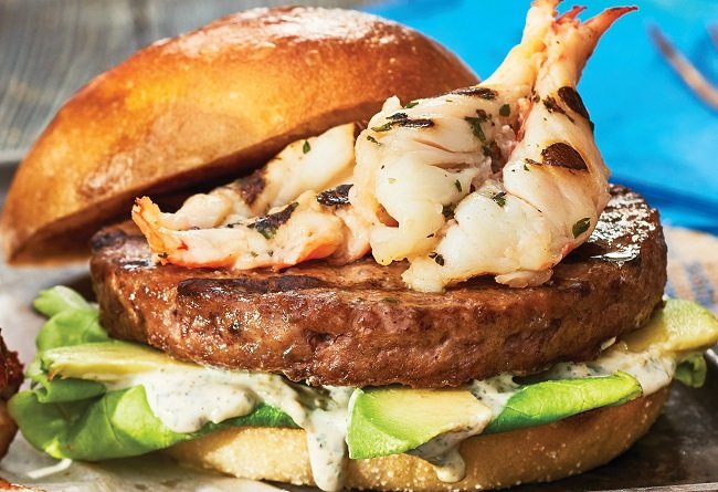 Hamburger with shrimp and avocado on a bun