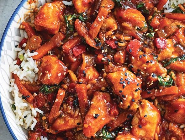 Gluten-free Spicy Sesame Chicken and Rice on a decorative plate