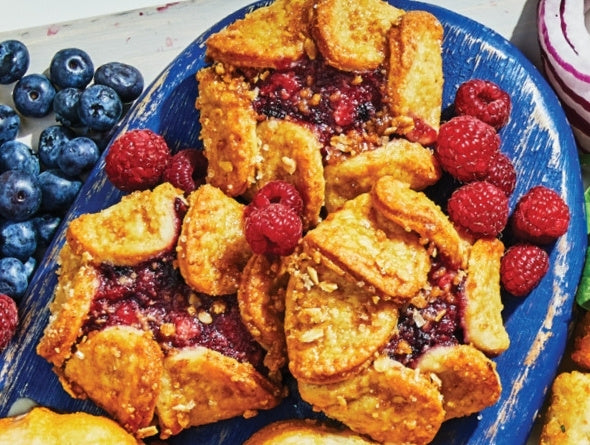 Baked Bumble Blossom pastries frozen desserts with berry filling on a blue plate
