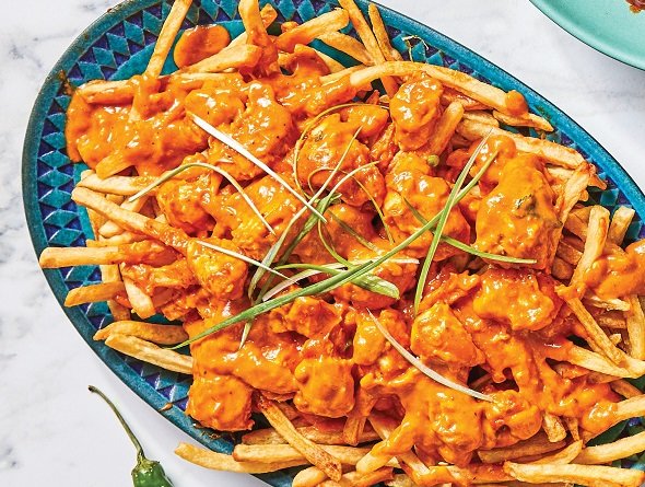 Fries topped with Butter Chicken 