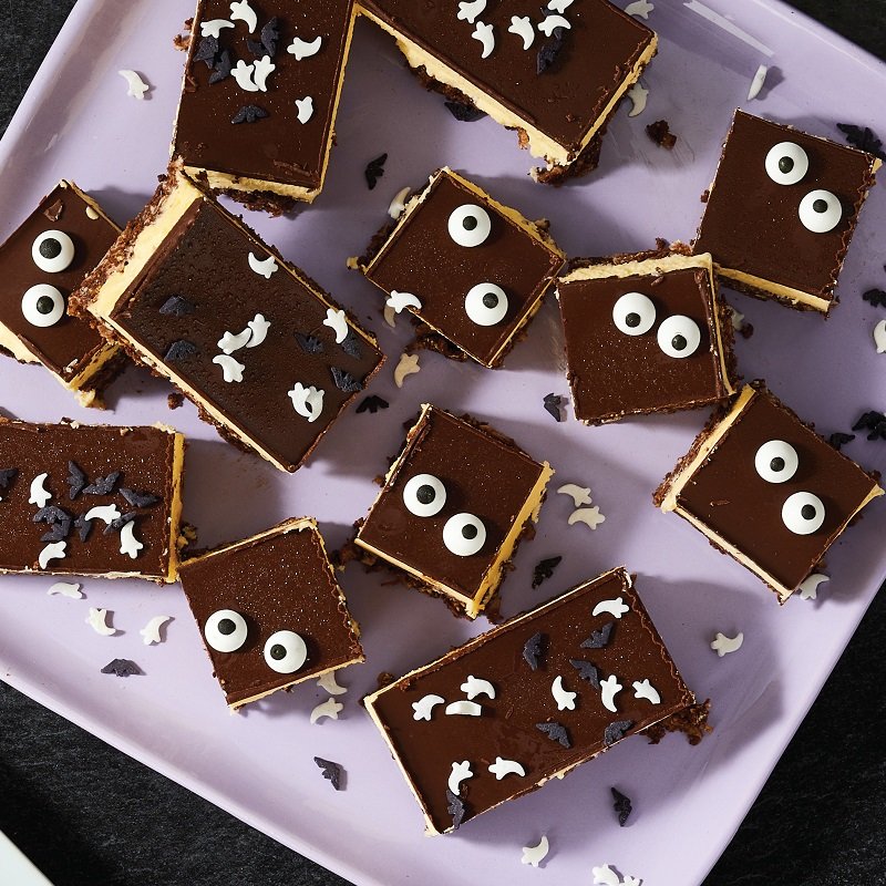 Thaw-and-serve Nanaimo Bars decorated with Halloween candies