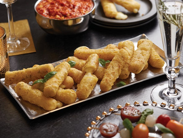 Tray of Mozzarella Sticks with a side of marinara sauce on a dark surface.