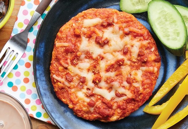 Prepared from frozen pizza with cucumber slices on a plate